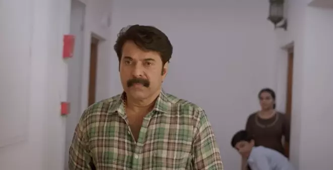 A still from Puzhu (2022). Kuttan is the exact reversal of the umpteen macho-brahminical superman roles Mammootty has played in the past.