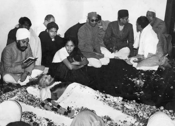 Image result for image of Mahatma Gandhi on assassination in lying down posture